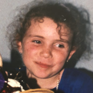 face of small girl wearing a sari